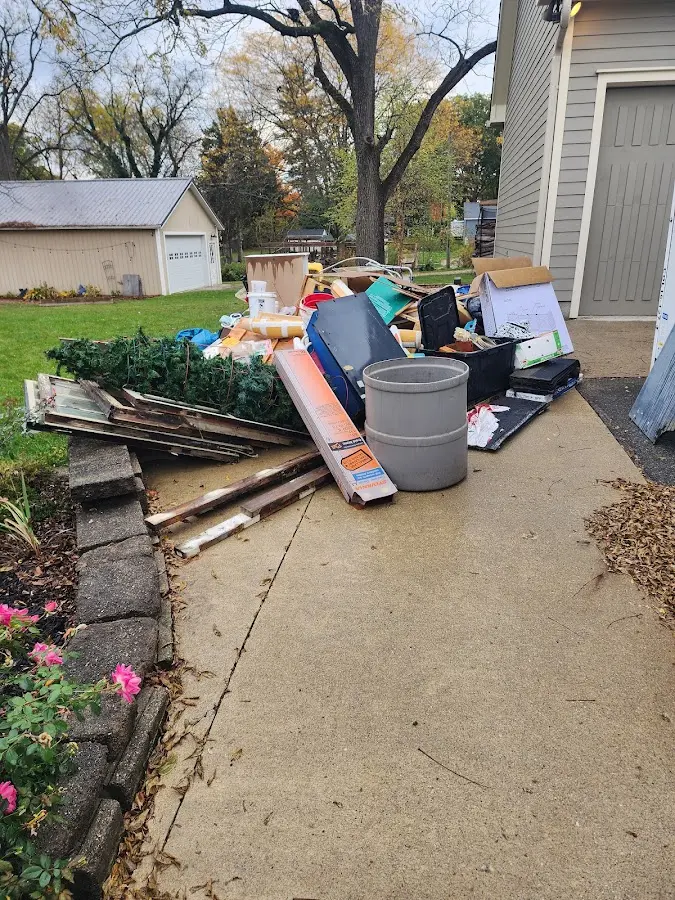Dumpster being loaded with debris for 3 Yard Dumpster Rental in Lanai City